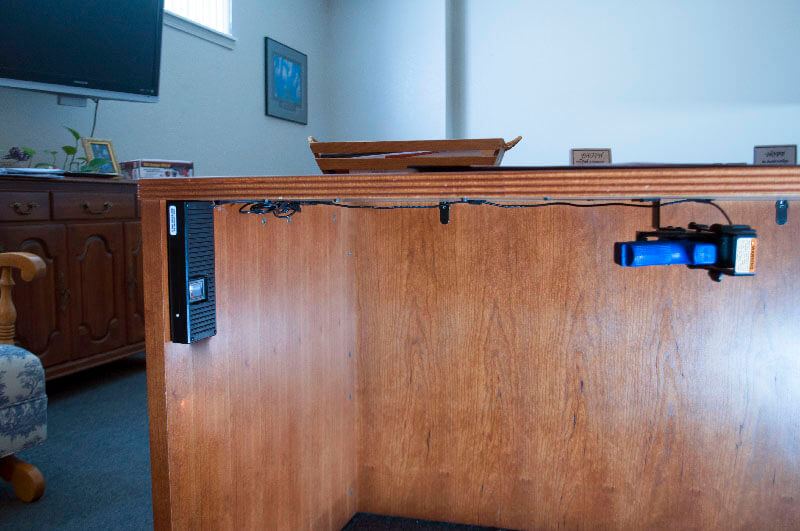Perfect for use in the office, the BIO Handgun Holster provides quick and reliable access to your handgun. In this image, the BIO Handgun Holster is mounted under an office desk for security.