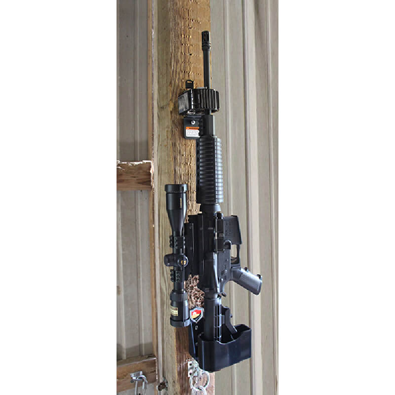 Wall Hanger Gun Rack by Jotto Gear mounted on the wall of a barn. Lock up your home defense firearm.